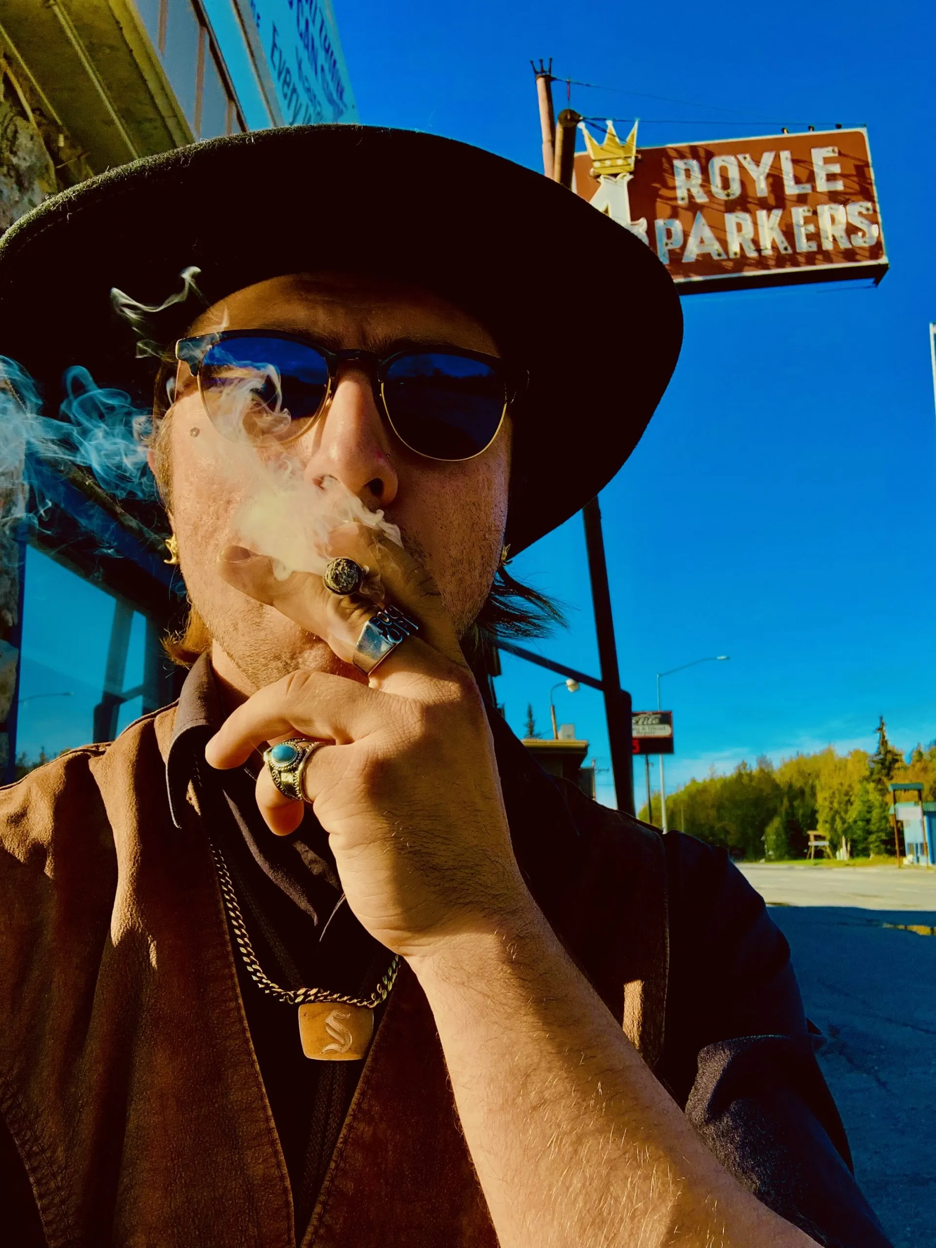 Ayden See smoking outside of Royle Parkers in Soldotna, AK.